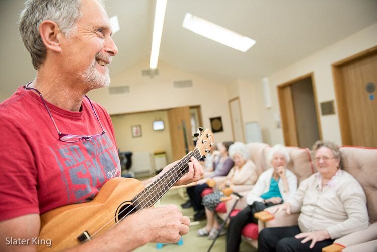Worcester care home daily life & activities - image of man playing guitar